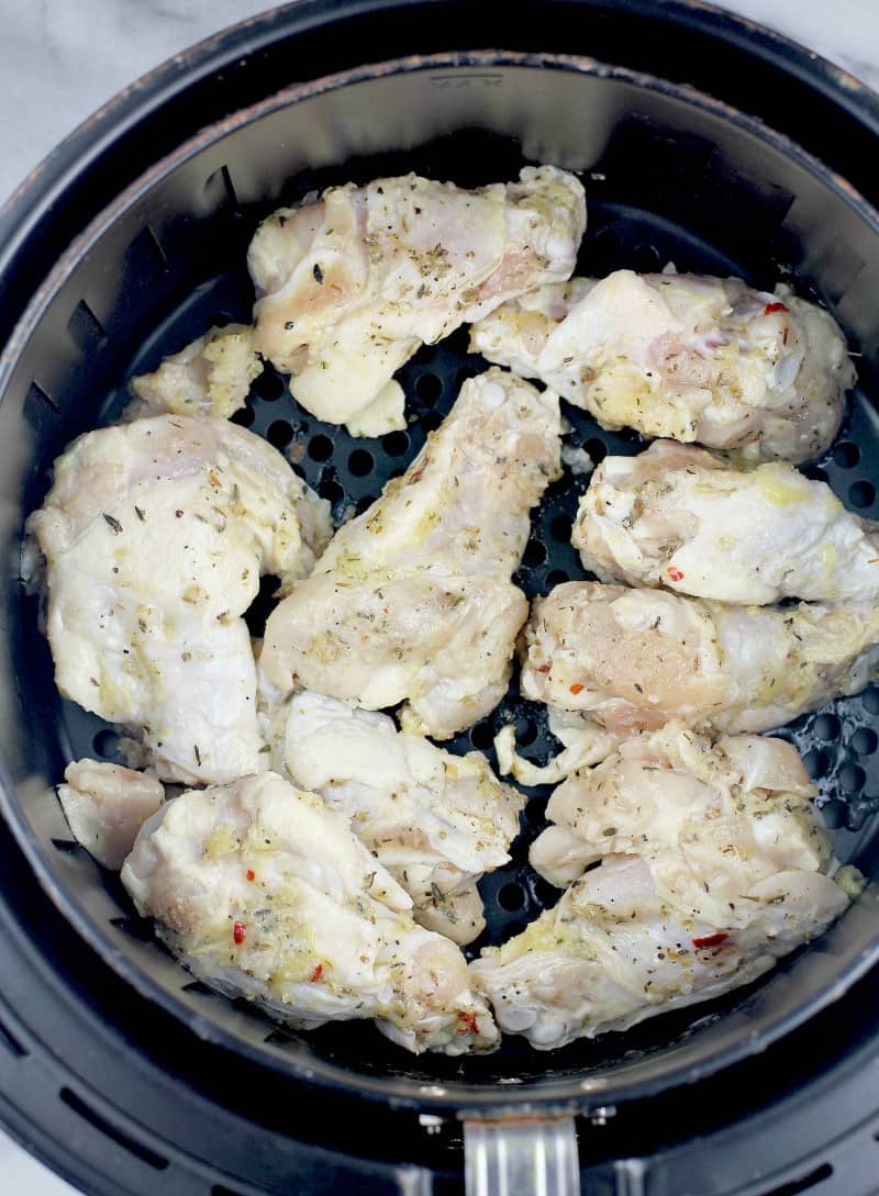 raw chicken wings in the air fryer basket