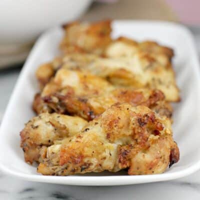 cooked air fryer Greek-style chicken wings on a white plate