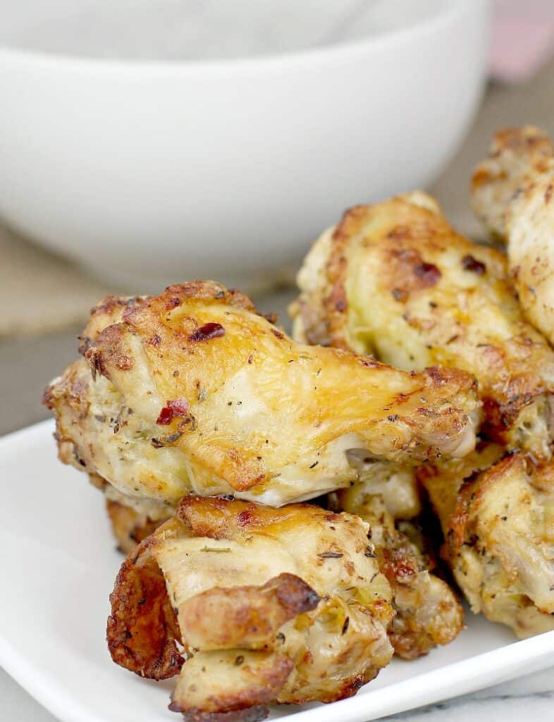 stack of air fryer drumettes on a white dish