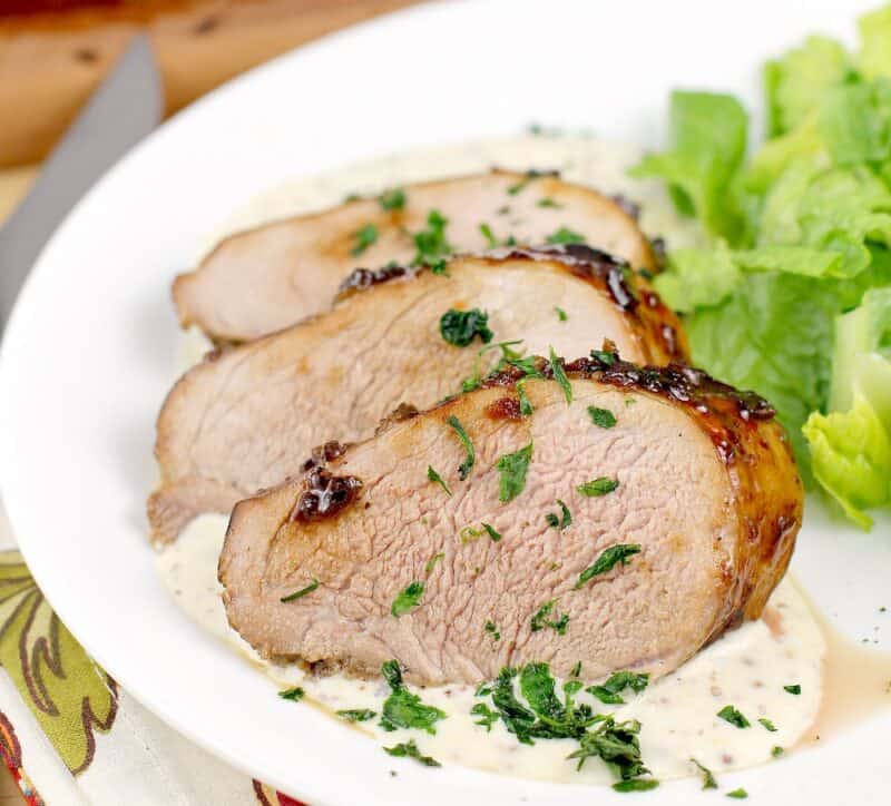 plated recipe showing doneness of the meat, on white plate