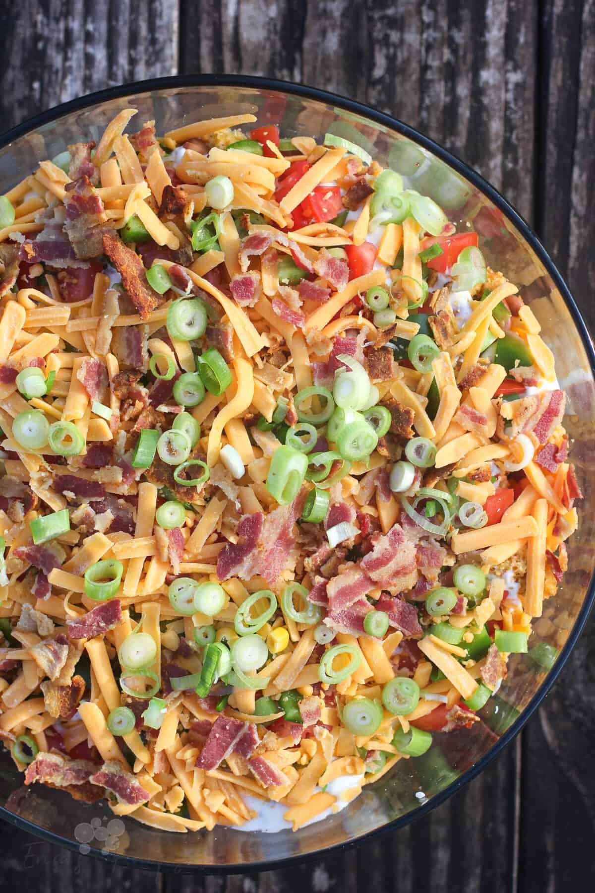 top down view into glass bowl with jalapeno cheddar cornbread salad