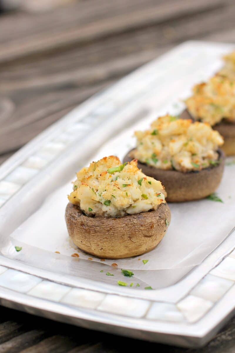 crab stuffed mushroom on a metal dish