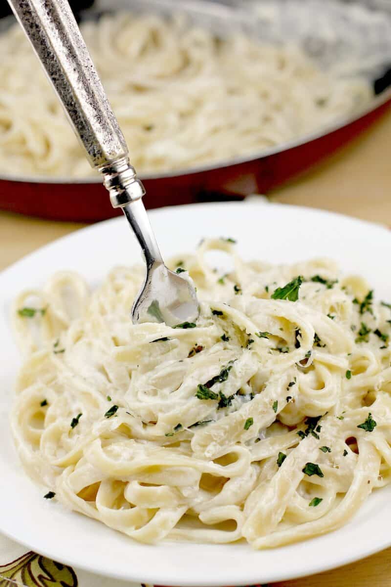 fork twirling up fettuccine alfredo