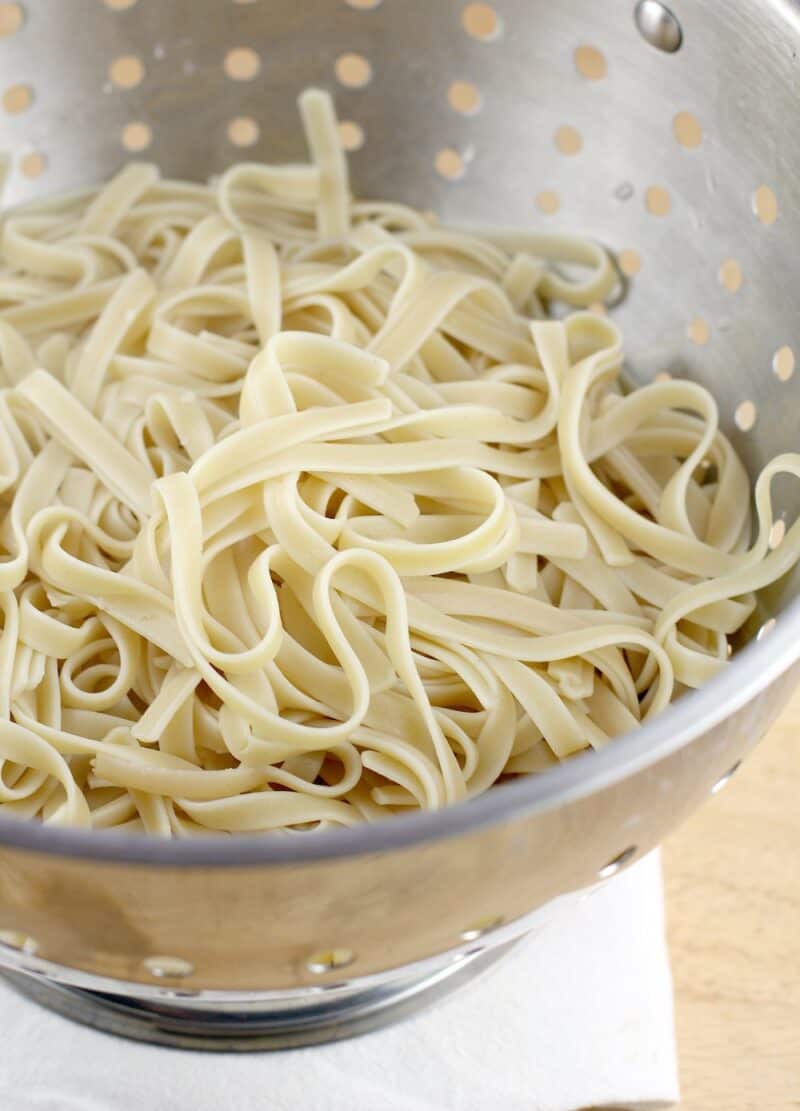cooked pasta draining in a colander
