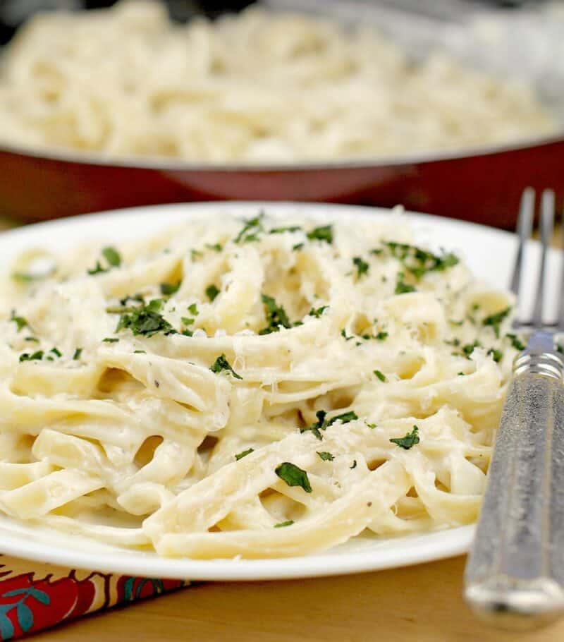 close view of the pasta in cream sauce on a white dish