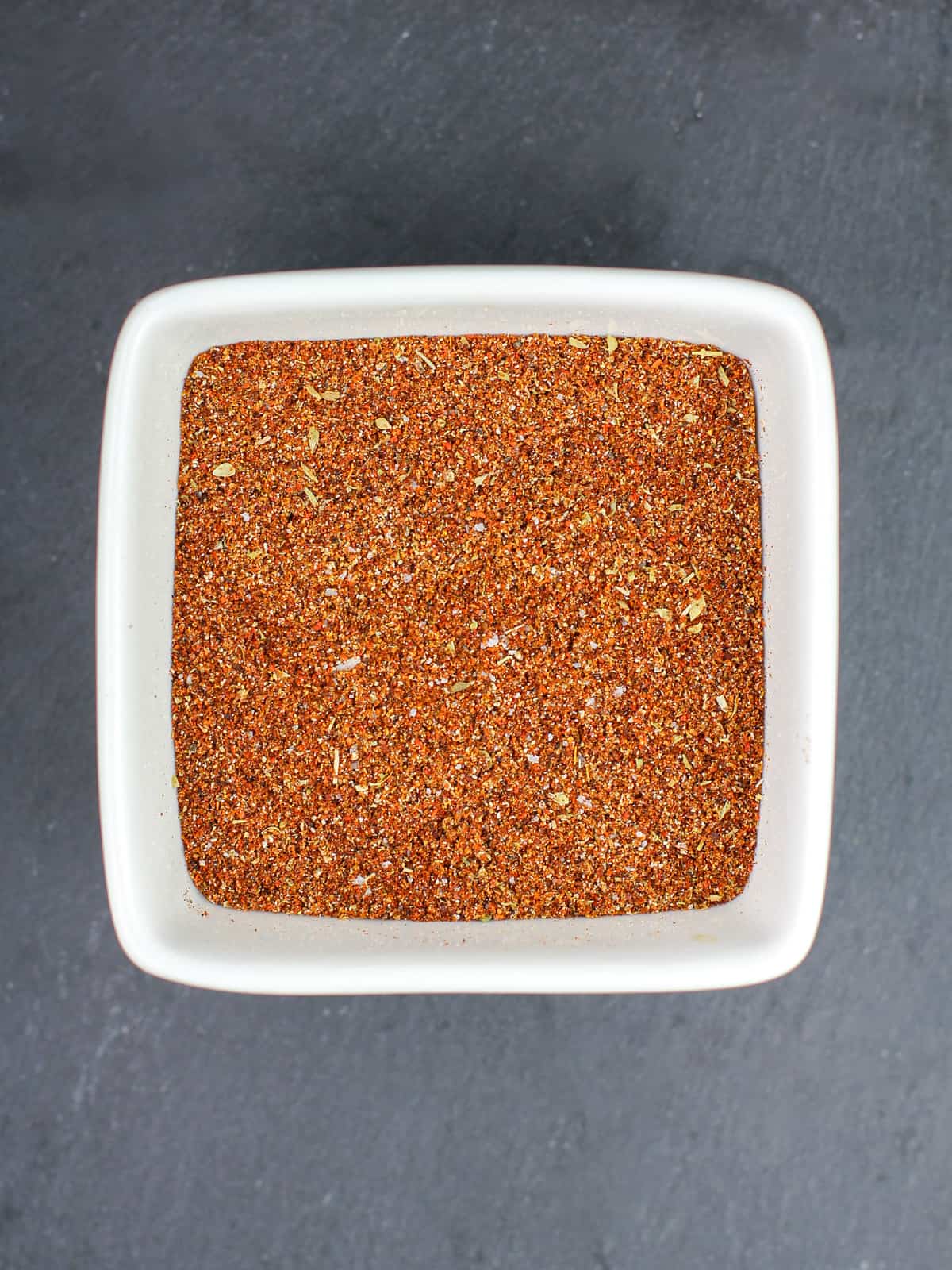 white square bowl filled with taco seasoning mix