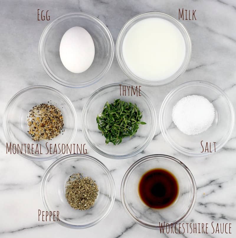 marble surface with small glass bowls, each containing a difference meatloaf ingredient