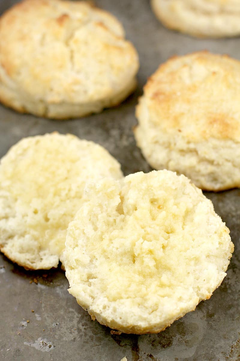 biscuit sliced in half with butter on it