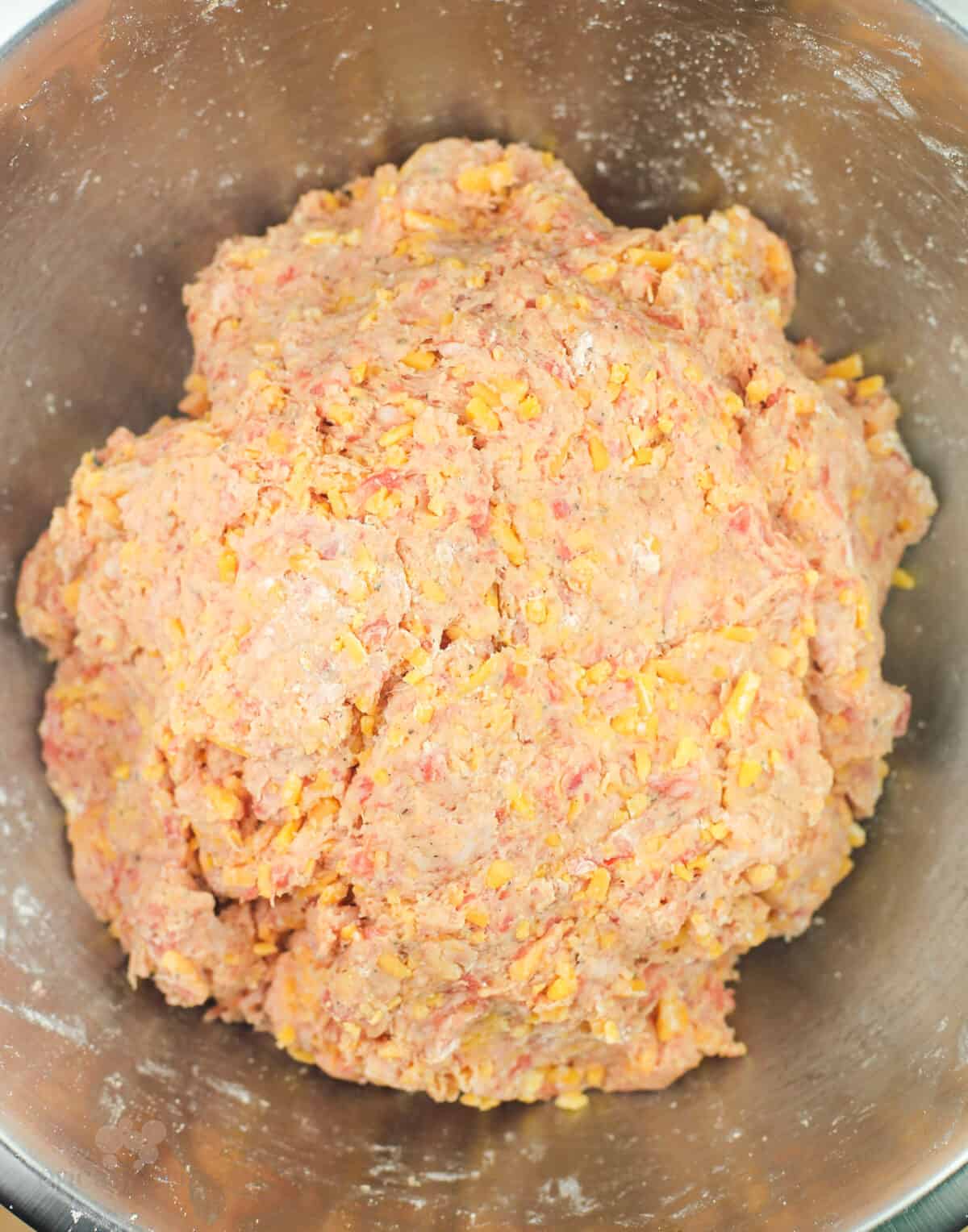 prepared dough in metal mixing bowl