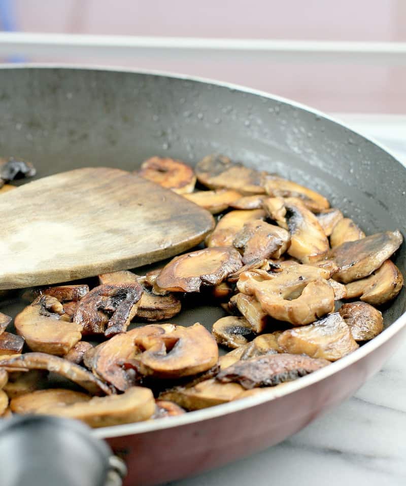 mushrooms browned in a skillet.