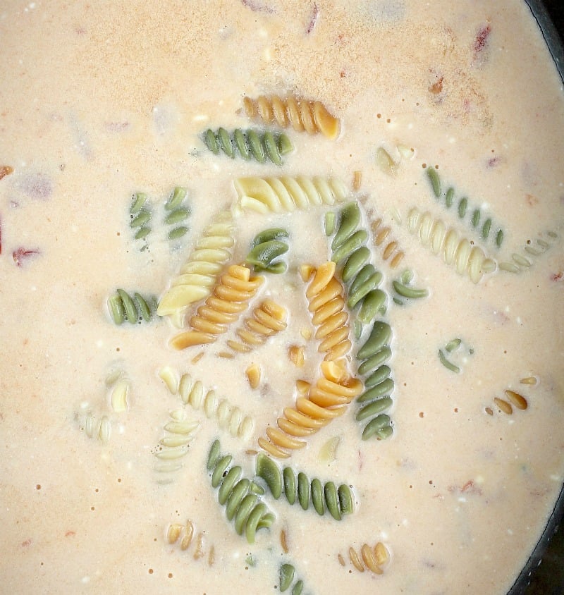 top down view of the slow cooker soup showing the pasta added