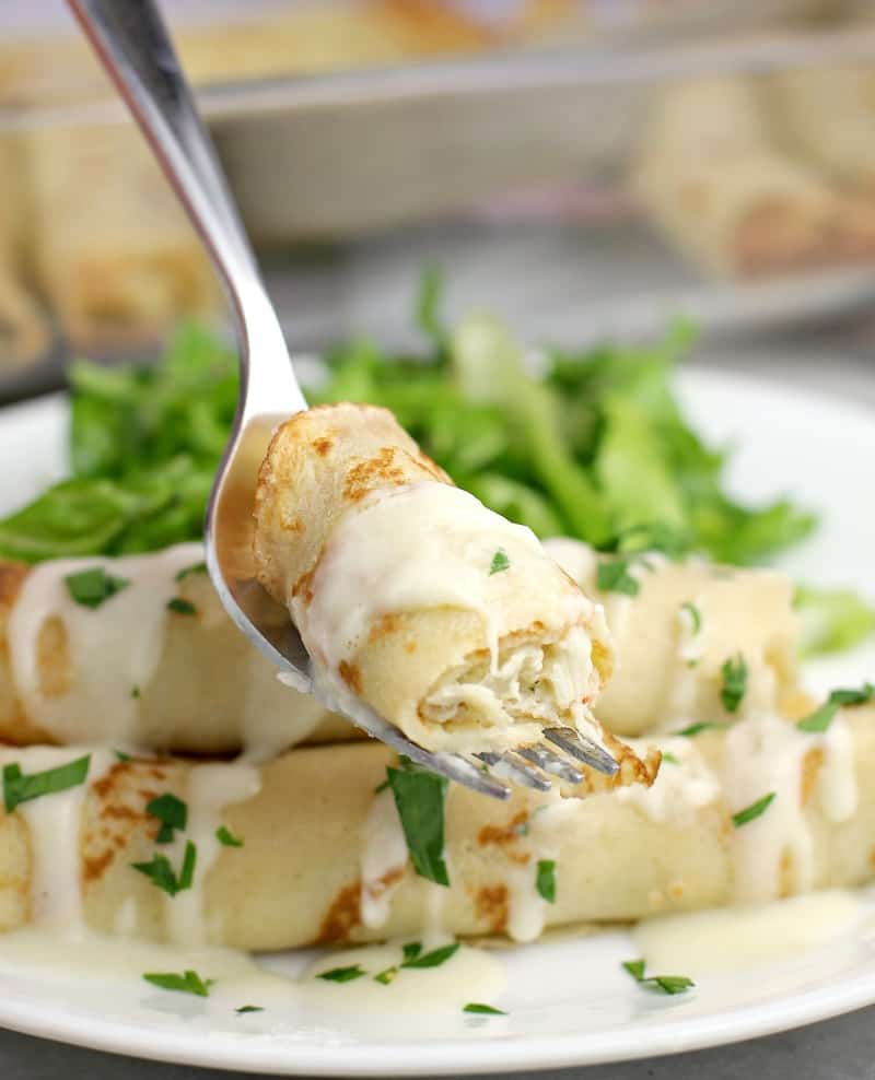 piece of crab-stuffed crepe on a fork