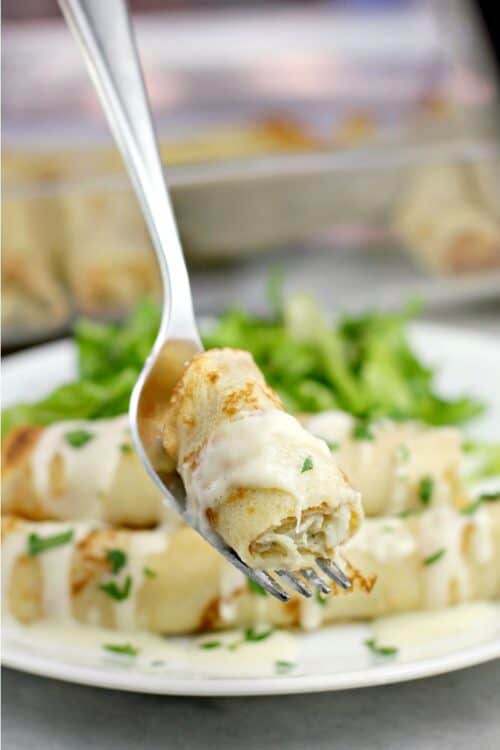bite of crab crepe on a fork