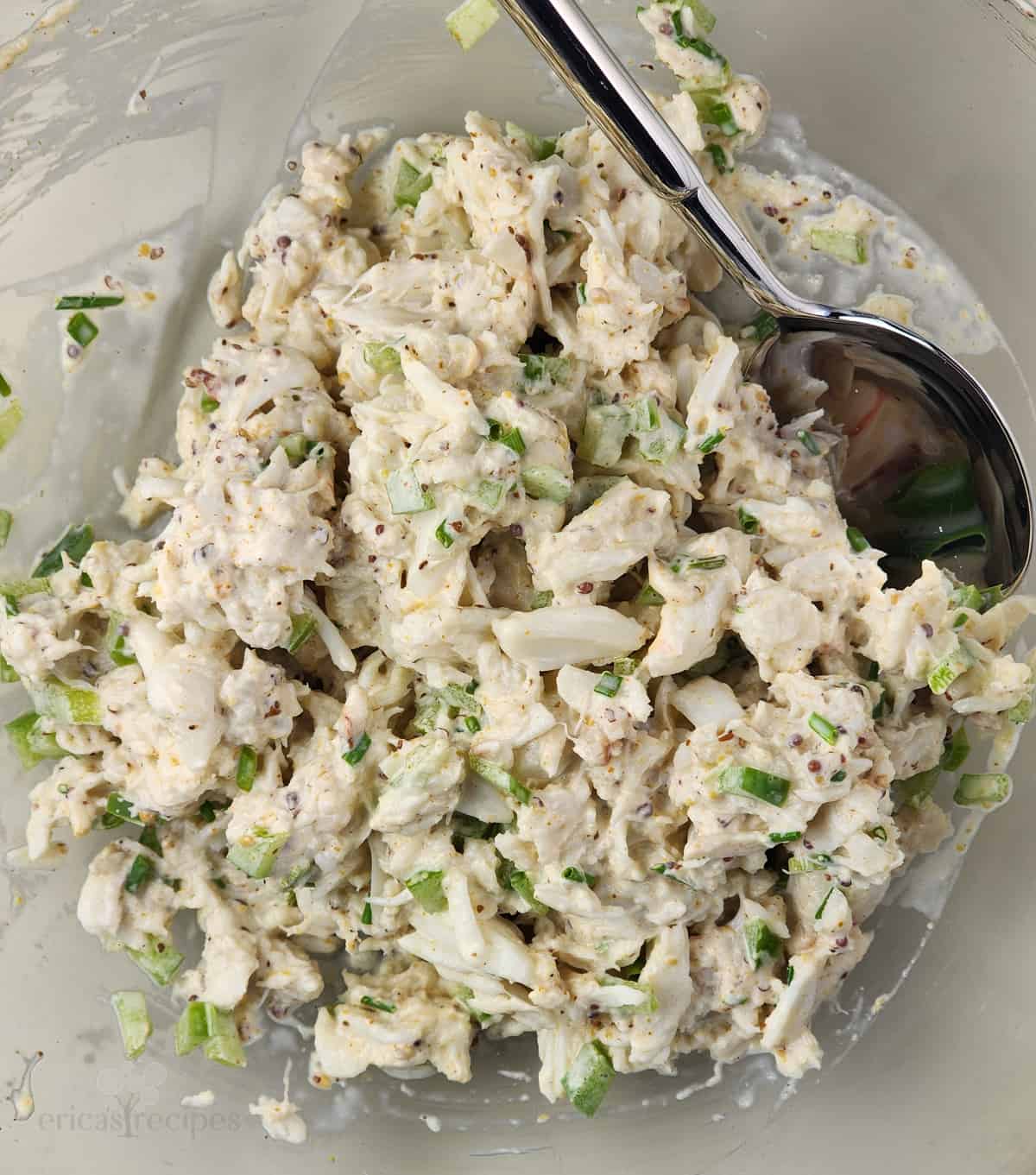 crab salad in glass bowl with spoon
