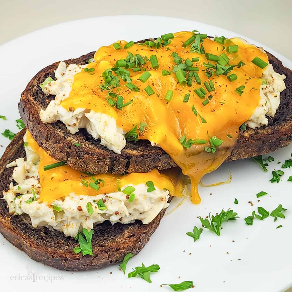 crab melt sandwiches on white plate