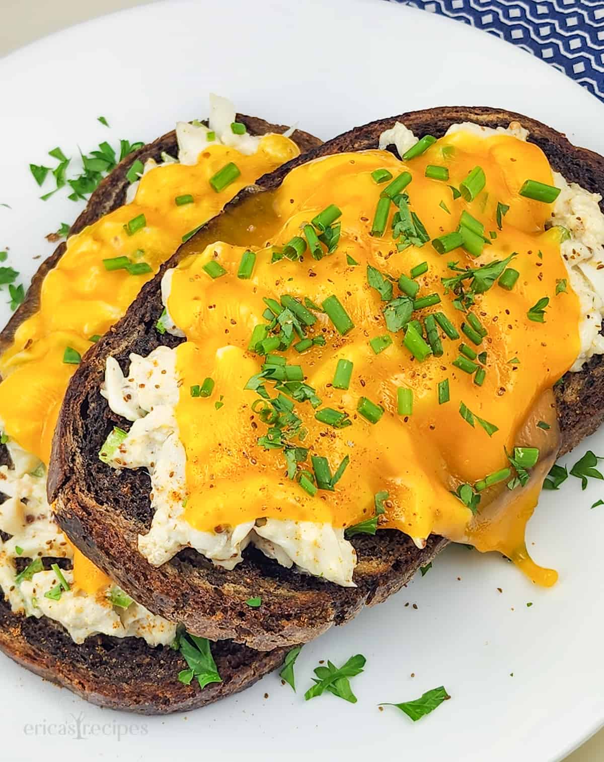 crab melt sandwiches on white plate