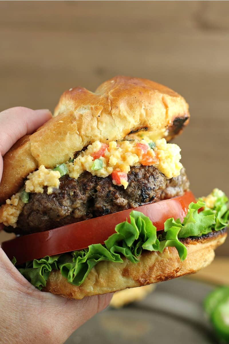 hand hold up a pimento cheese burger