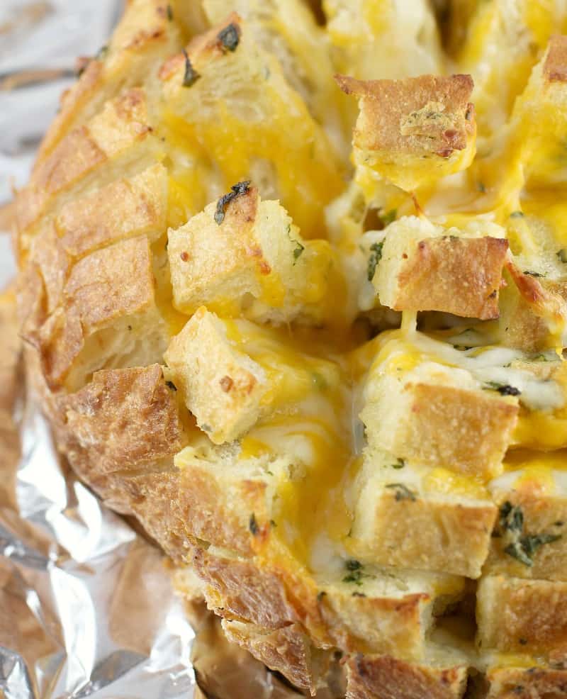 top down, zoomed view of the finished garlic cheese bread on foil