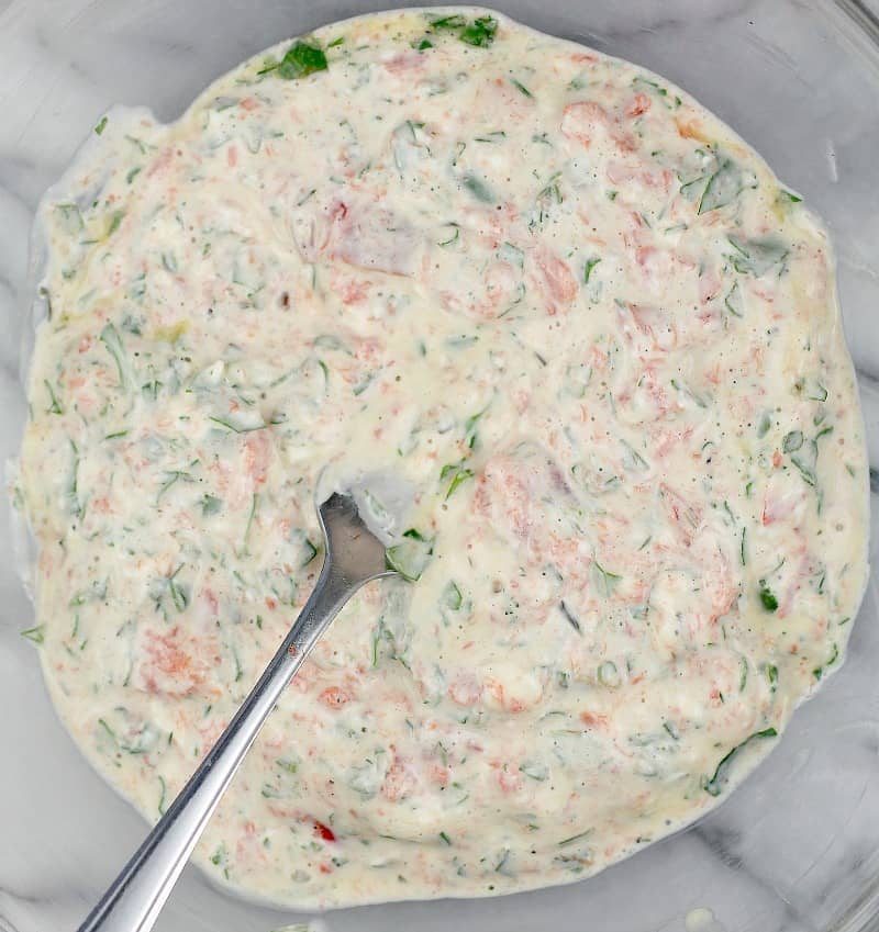 the combined filling in a clear glass bowl with a fork