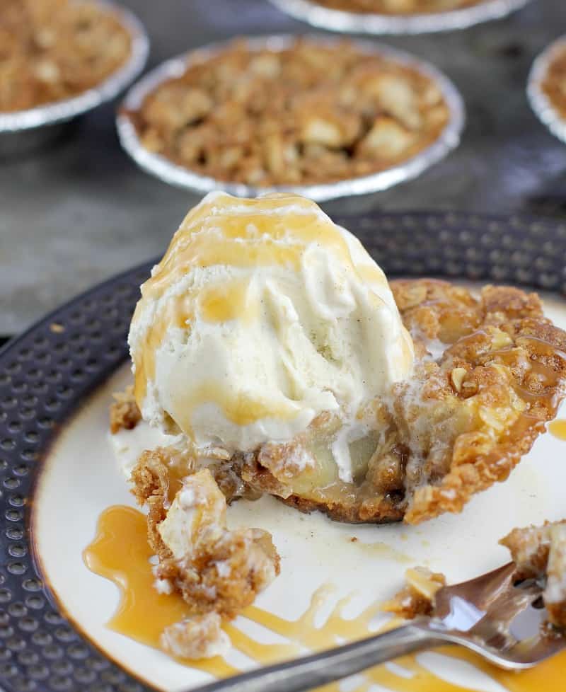 apple crisp pie on a plate with a bite removed