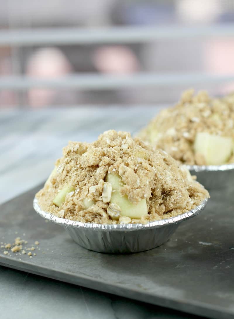 mini pie filled with apple and topped with streusel