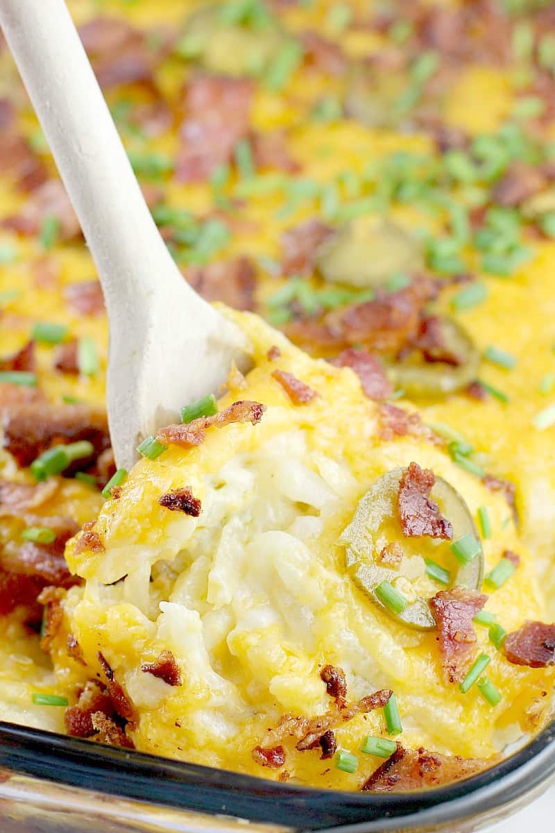 wooden spoon lifting up jalapeno breakfast casserole