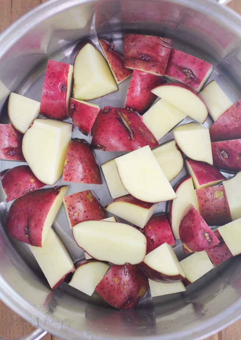 chopped red potatoes in metal pot