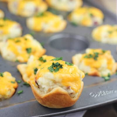 potato cup on the rim of muffin pan