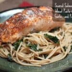 Seared Salmon over Whole Wheat Pasta with Kale, Garlic, and Pine Nuts