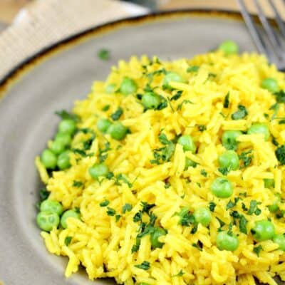 turmeric yellow rice on a grey plate