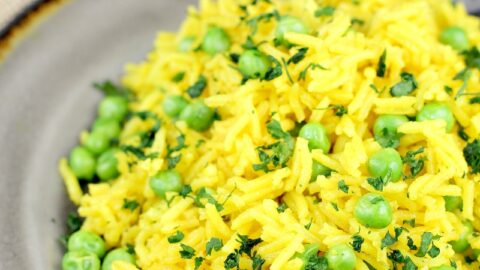 turmeric yellow rice on a grey plate
