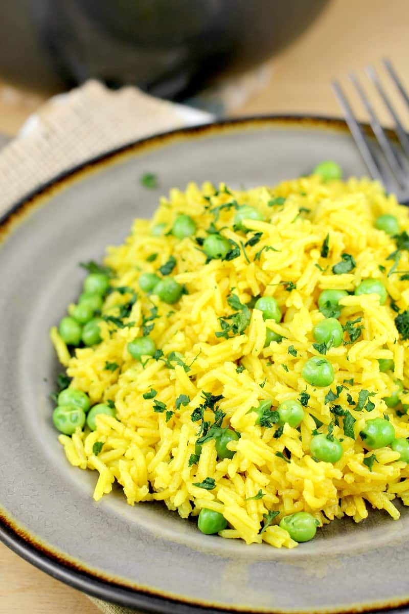 turmeric yellow rice on a grey plate