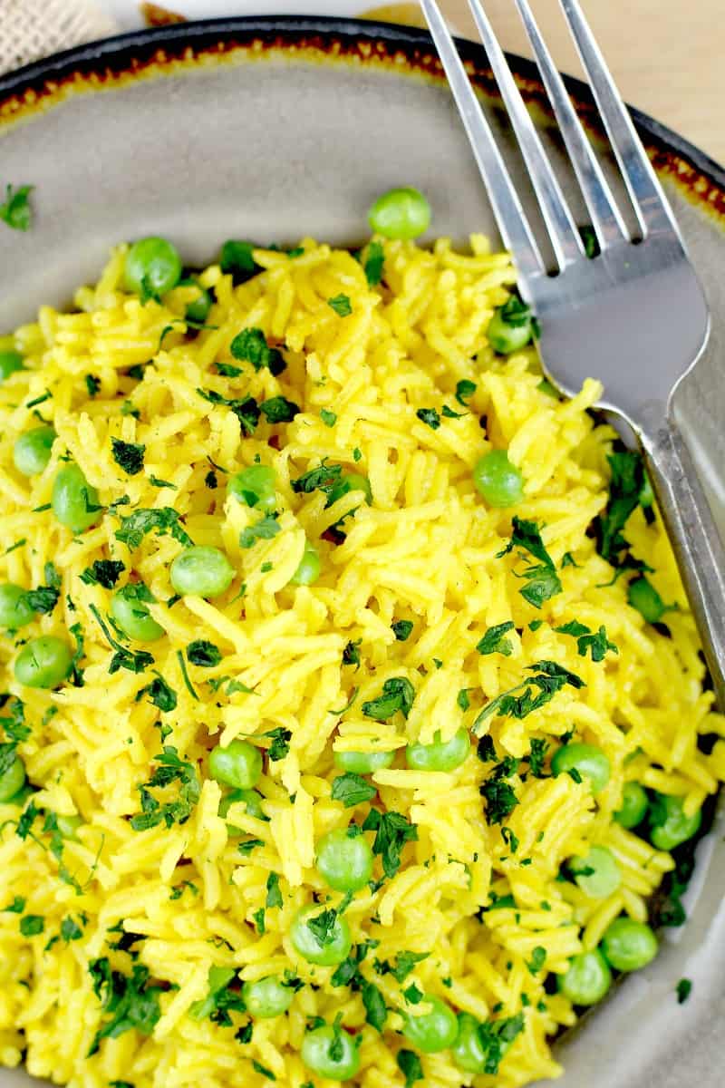 top down view of the rice on a plate with a fork on the side