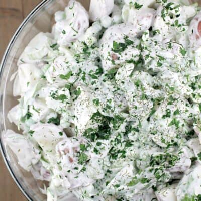spring potato salad with sour cream and dill in a glass bowl