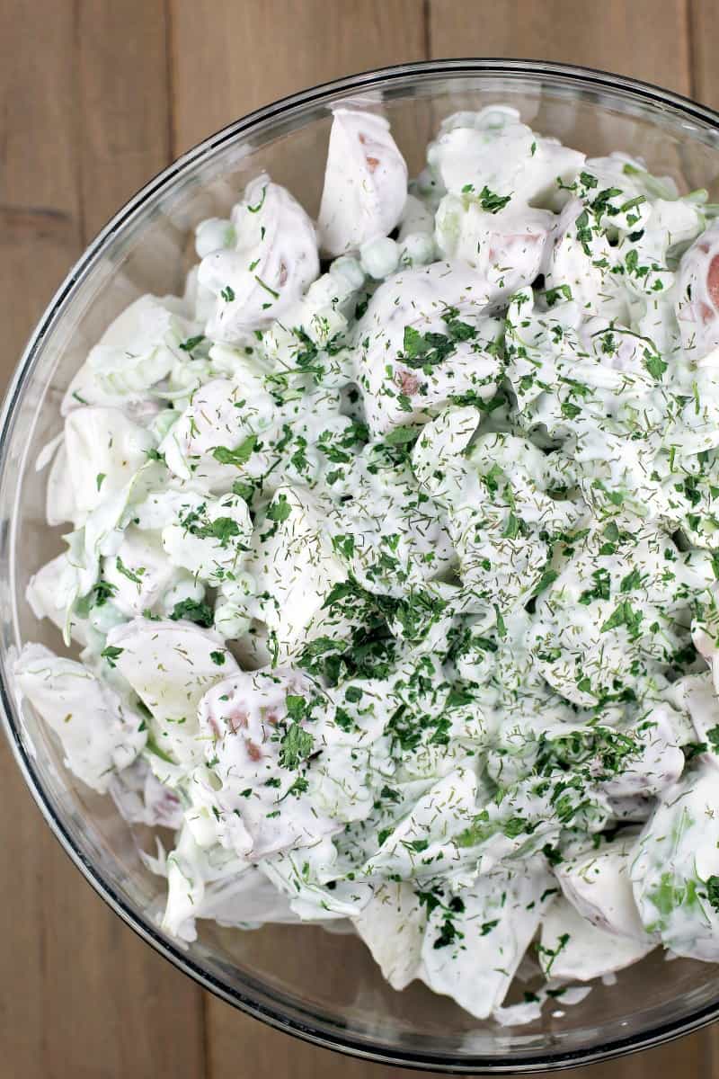 spring potato salad with sour cream and dill in a glass bowl