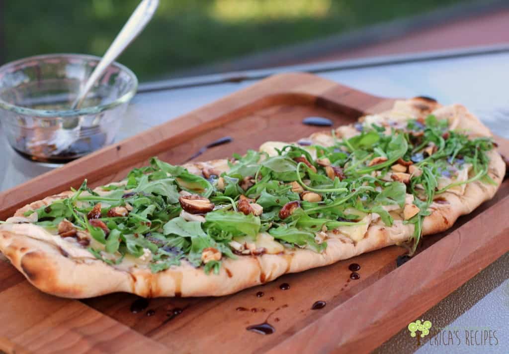 Grilled Flatbread with Brie, Arugula, Candied Nuts, and Balsamic-Honey Drizzle