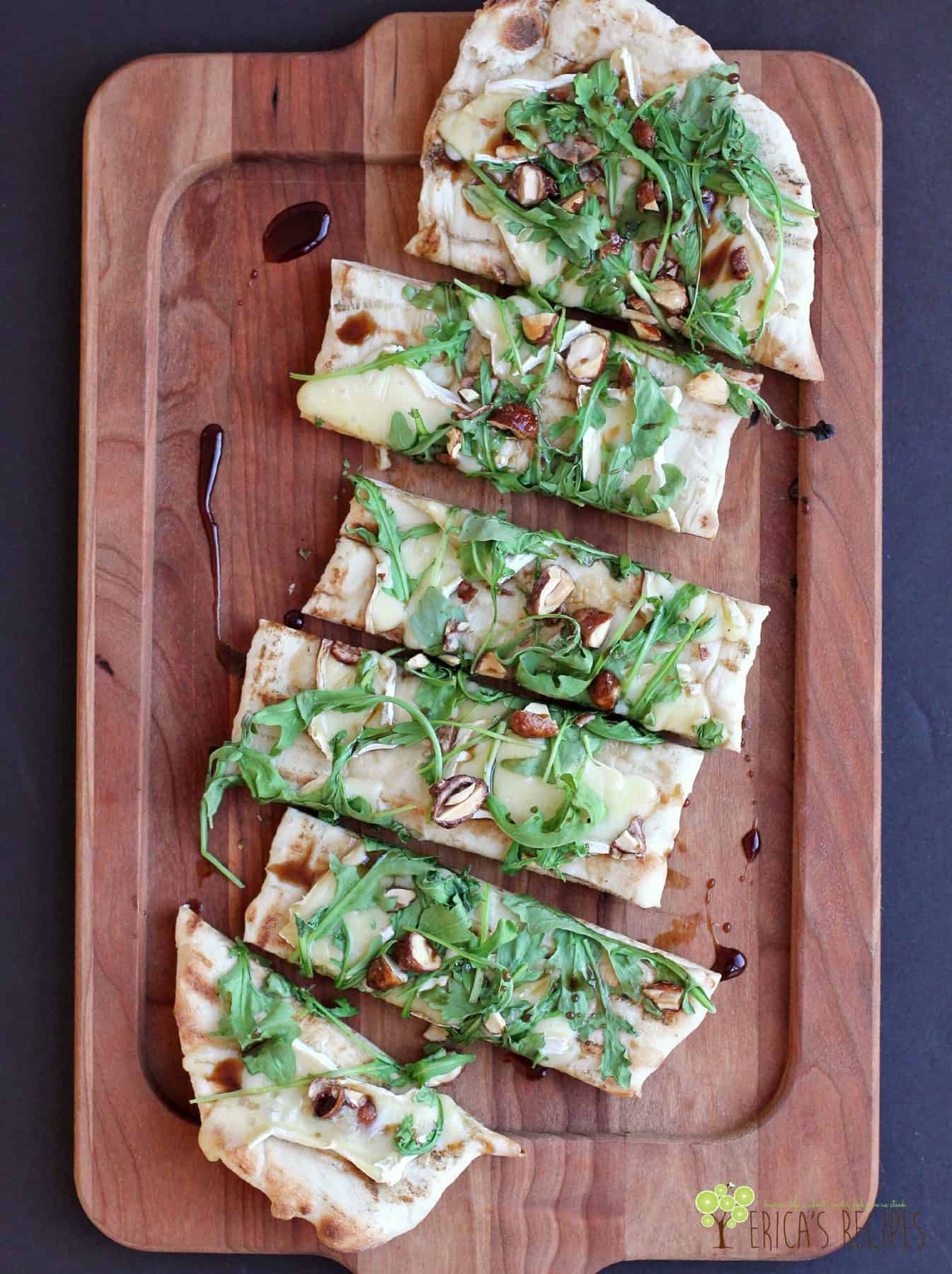 Grilled Flatbread with Brie, Arugula, Candied Nuts, and Balsamic-Honey Drizzle
