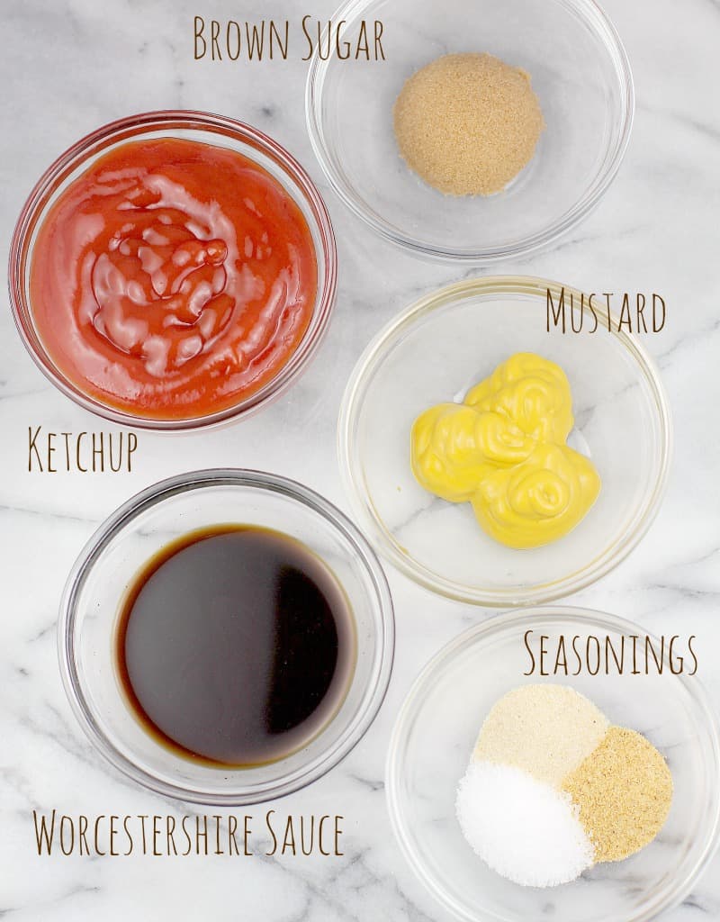 the ingredients for the sloppy joe mix in individual glass bowls on a white marble surface