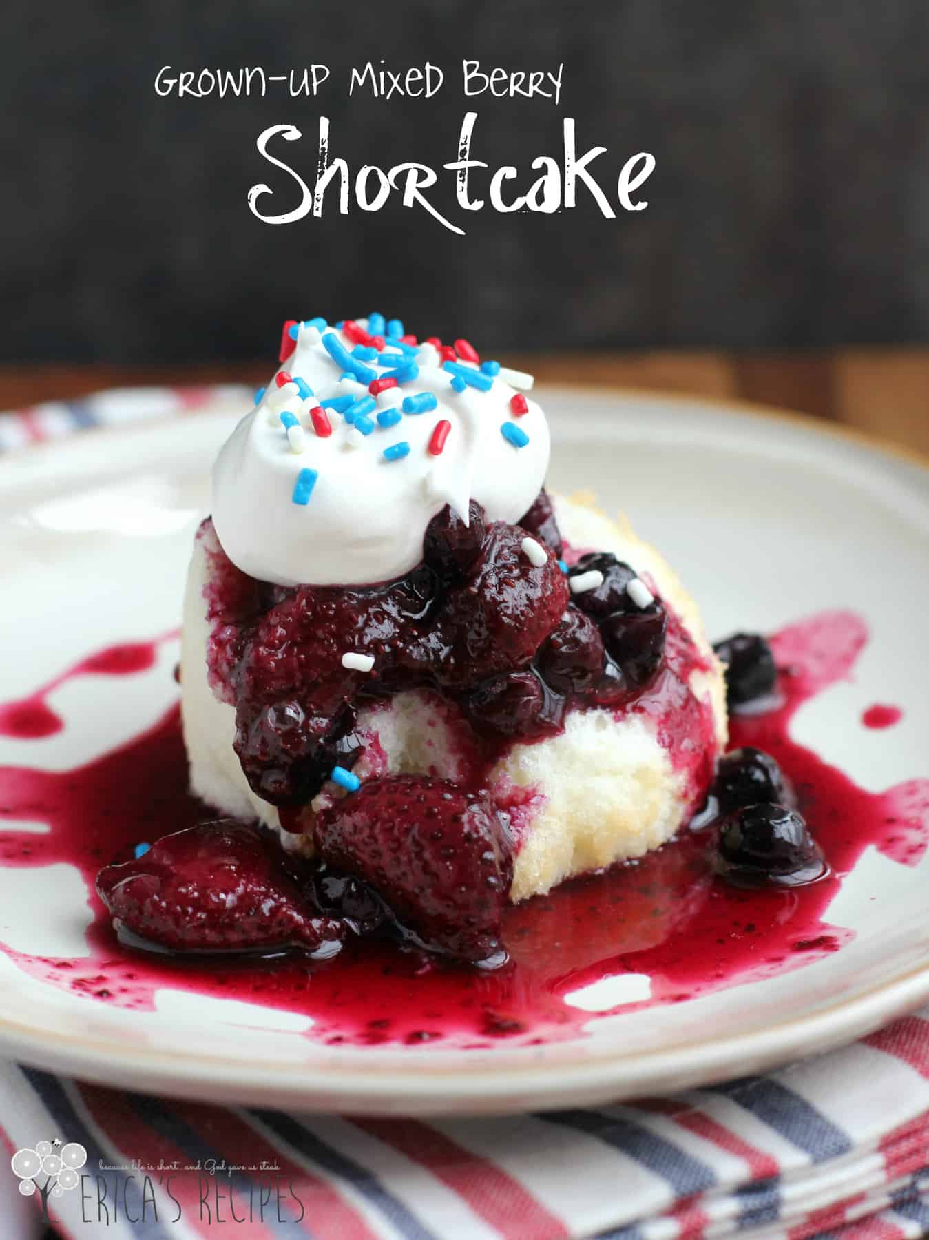 Grown-up Mixed Berry Shortcake! Sweet berries simmered with red wine to make a beautiful, elevated sauce to top light and sweet angel food cake. #food #recipe #dessert #shortcake #patrioticdessert 