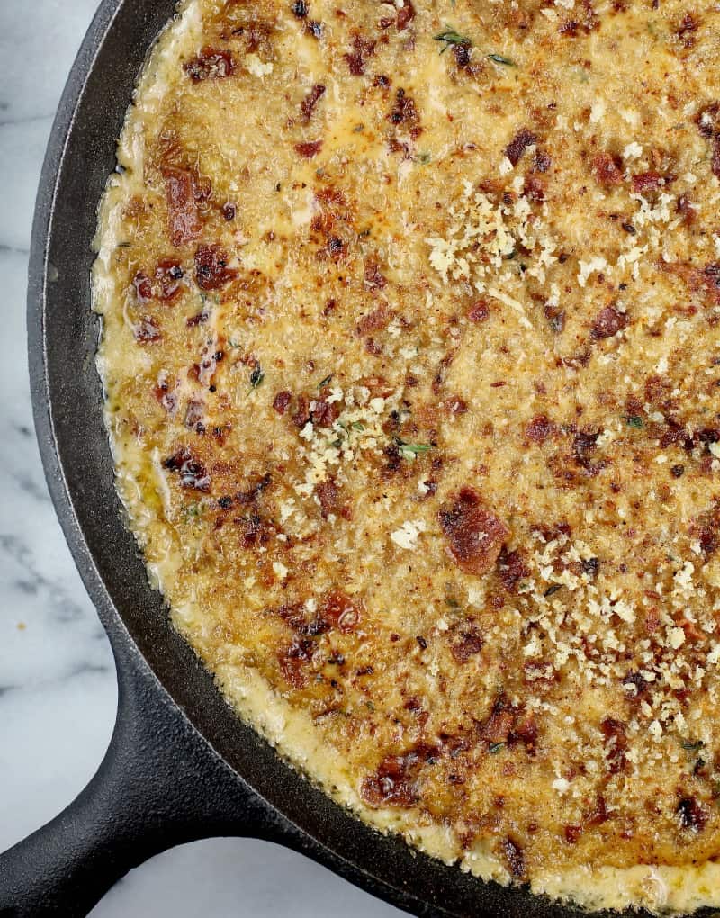 top down view of the cooked bacon macaroni and cheese in a large cast iron skillet