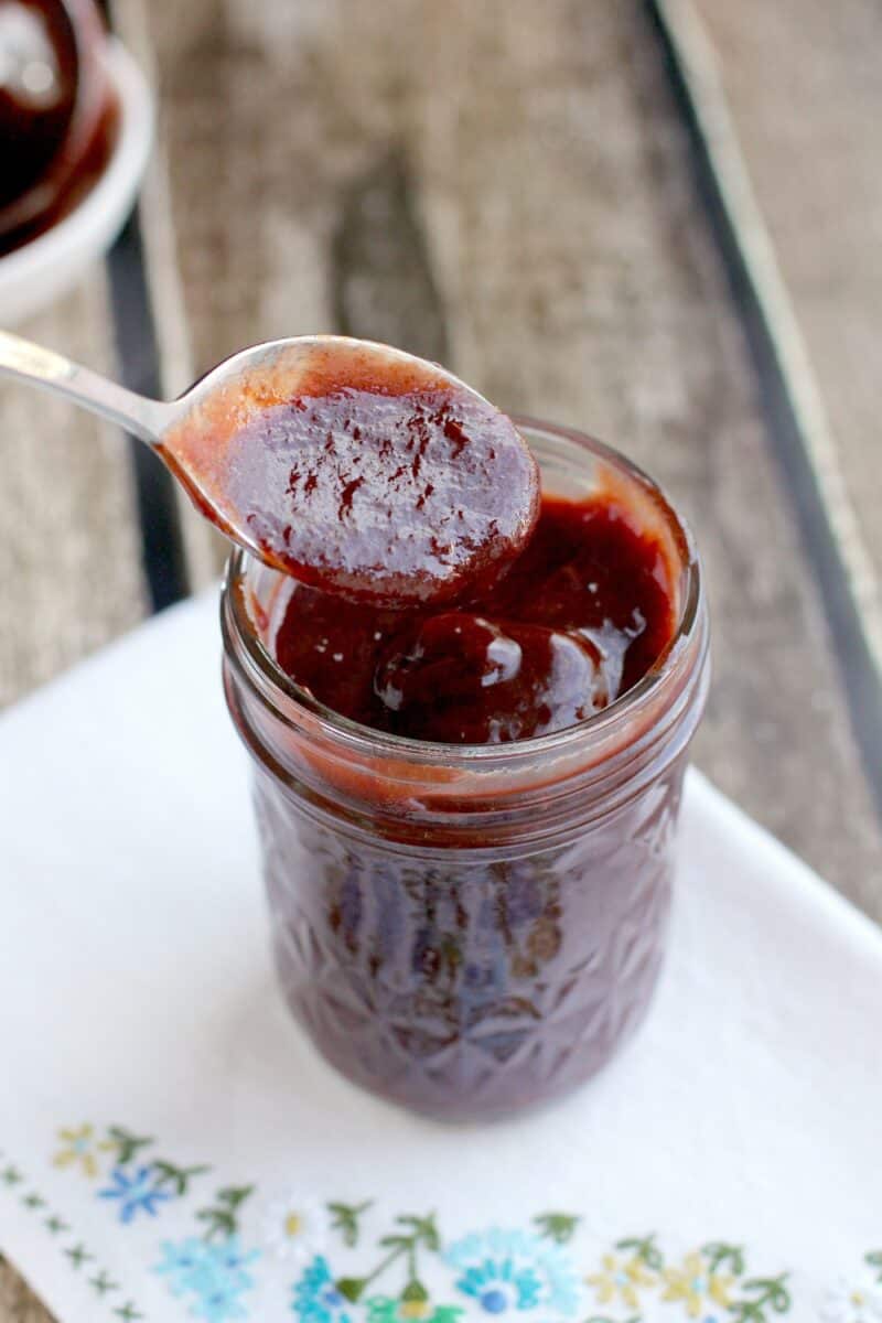 spoon in a mason jar with barbecue sauce