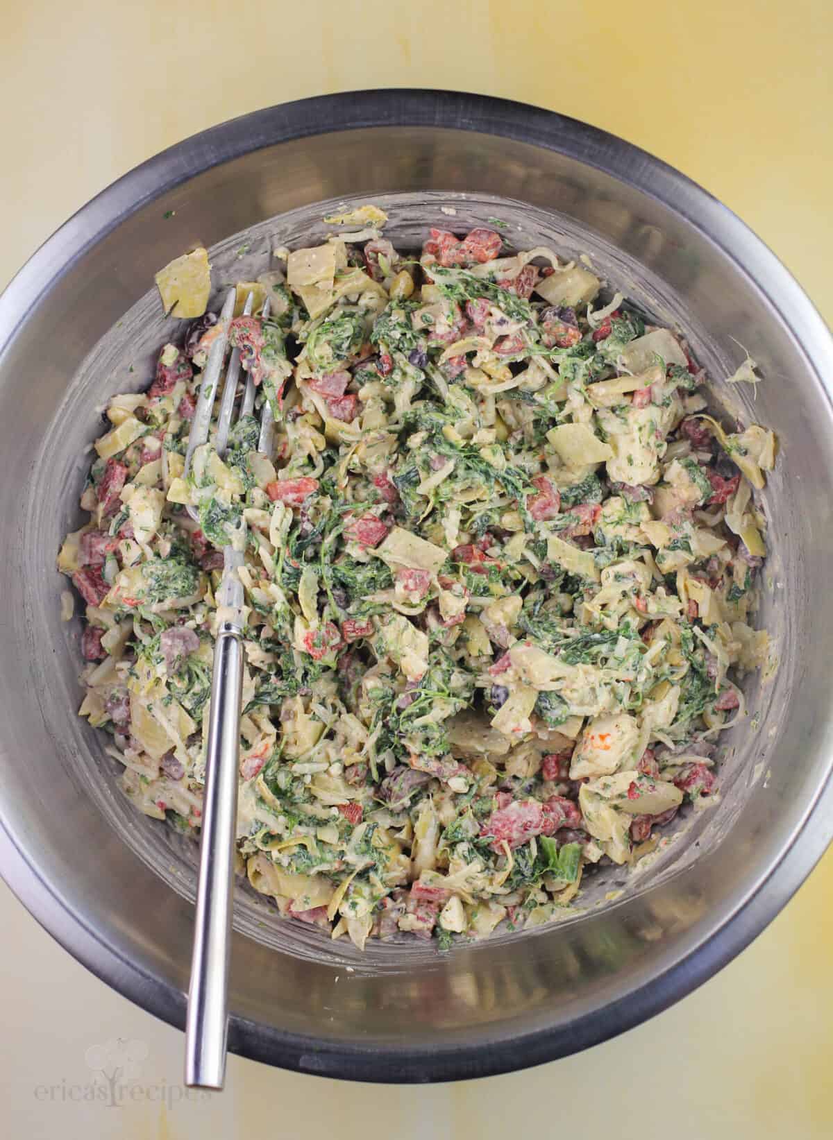 filling ingredients in mixing bowl with fork