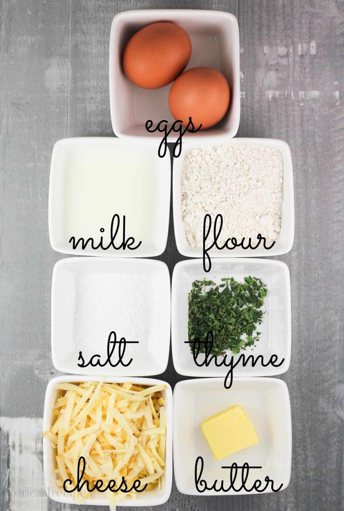 7 small white bowls with popover ingredients labeled