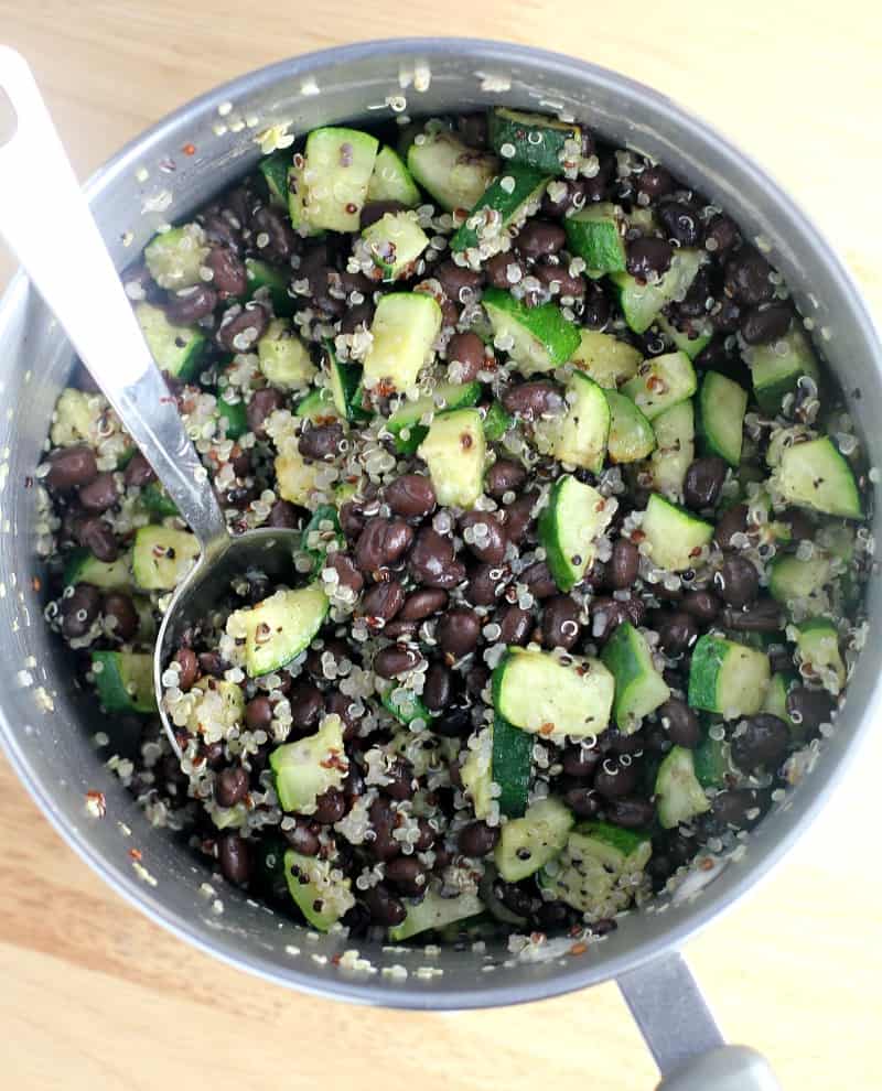 top down view into a saucepan of the assembled Mexican quinoa stuffing