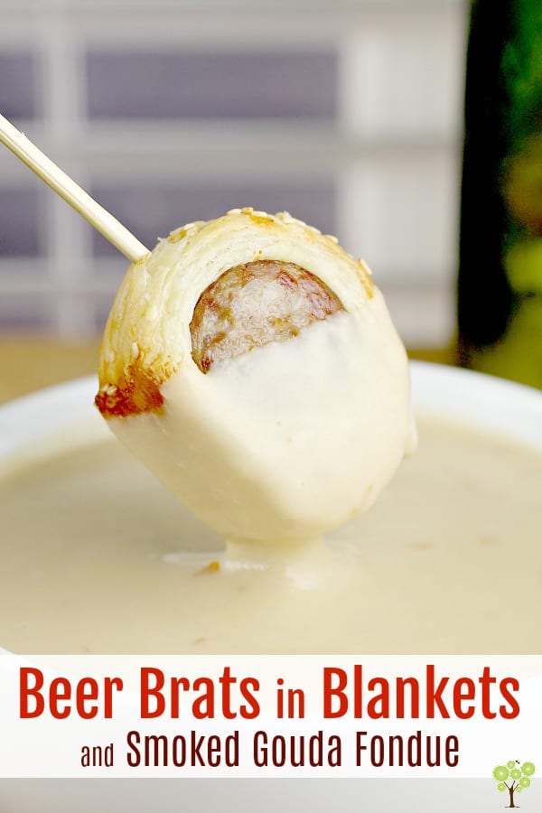 Savory bratwurst, simmered in dark German lager, wrapped in puff pastry, and served with a rich and smooth Smoked Gouda Fondue. This phenomenal combination of flavors and completely new take on "Pigs in Blankets" will make any party, any occasion, absolutely perfect. #food #recipe #appetizer #partyfood #brats #beer #fondue #gouda #cheese