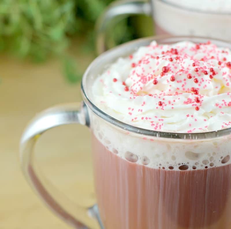 close view of whipped cream and sprinkles on red velvet coffee