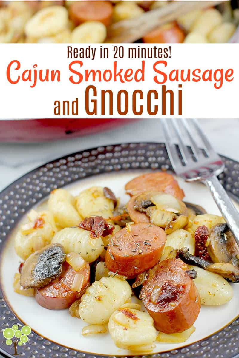 Smoked sausage cooked up with onion, mushrooms, garlic, sun-dried tomatoes, and lots of Cajun seasoning, then served with super easy gnocchi. This new dinner idea is ready in under 20 minutes and versatile so we can change it up however we like to help us during this busy time of the year. #cajun #gnocchi #easydinner #quickcook #sausage #food #recipe