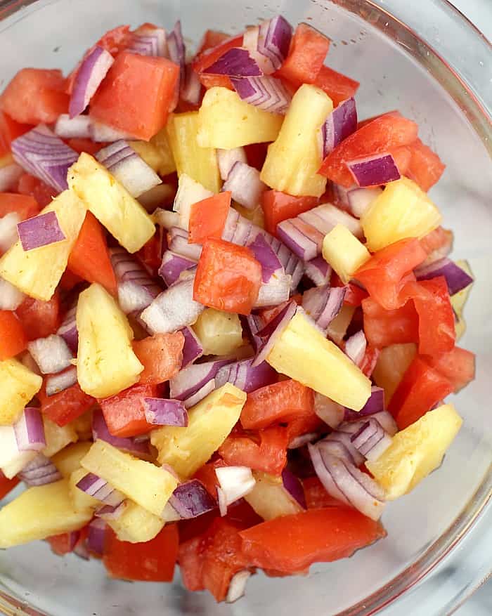 pineapple salsa in a clear glass bowl