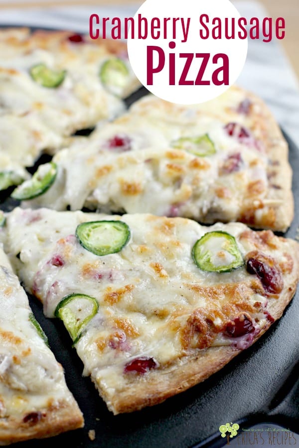 A little tart and a little spice highlight this super cheesy, super delicious, fun gourmet pizza. Two cheeses, tart cranberries, spicy sausage and jalapeno, and a dreamy Dijon cream sauce to die for, make this easy Cranberry Sausage Pizza recipe for your next pizza night. #recipe #food #pizza #cheese #sausage #capecodselect #frozencranberries #cranberriesforallseasons #gourmetpizza #creativerecipe