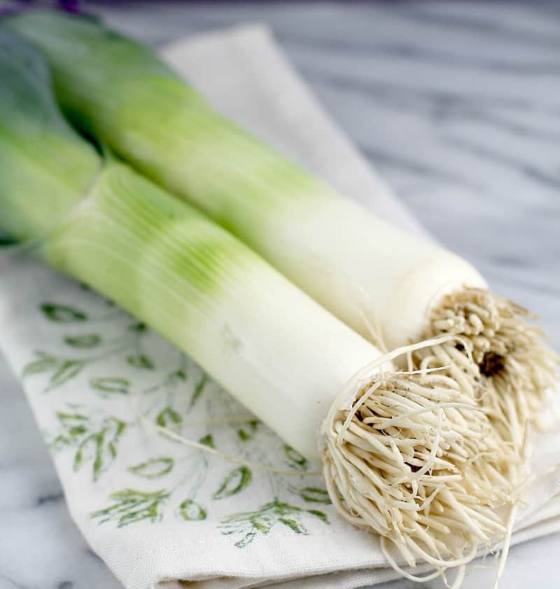 2 leeks on a cloth napkin